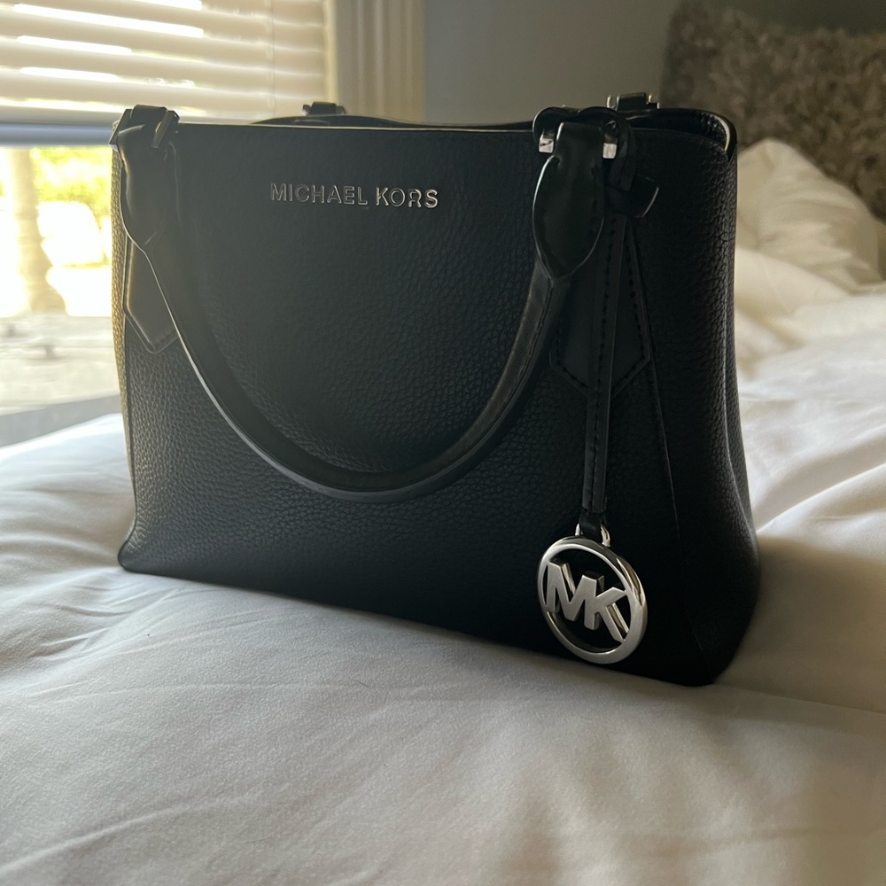 Barely used Micheal Kors black & silver purse